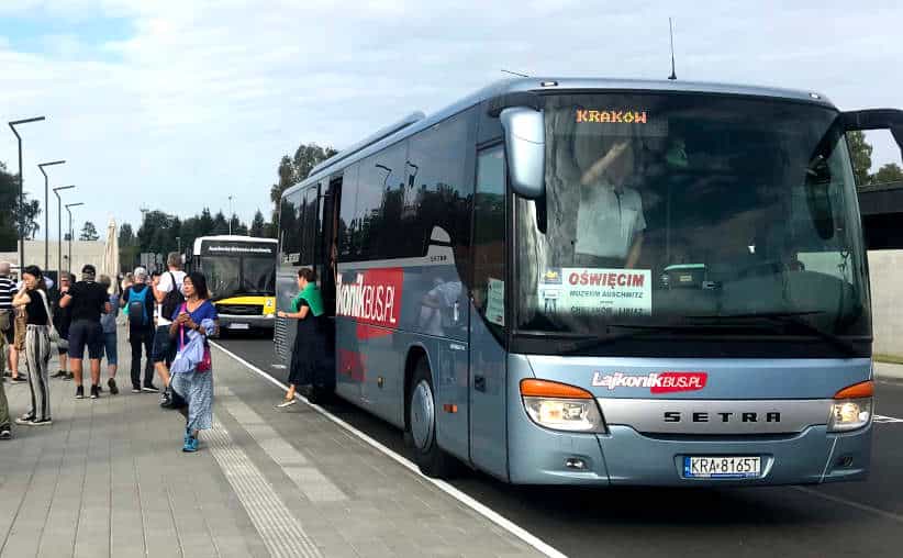 Lajkonik bus which just arrived from Kraków near the entrance to the Auschwitz Memorial at the main parking lot.