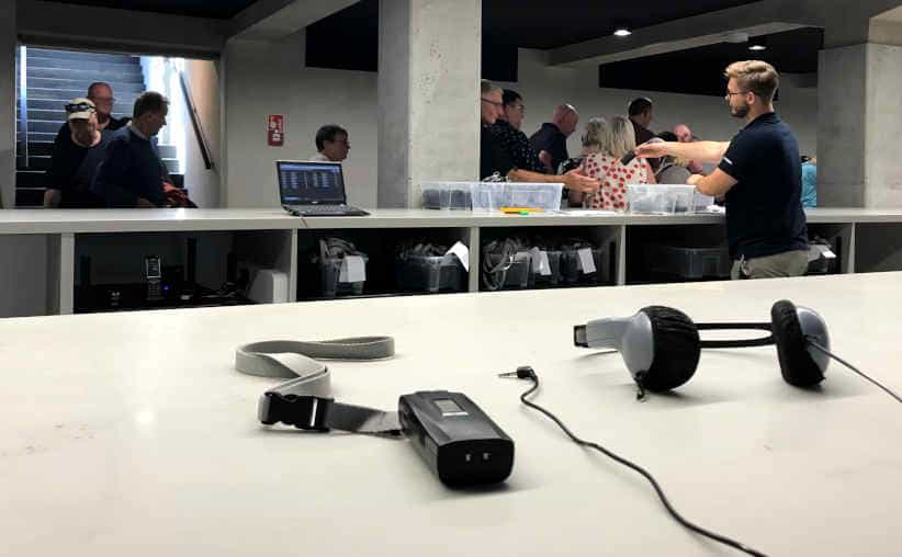 Headset distribution downstairs at Auschwitz I Main Camp reception.