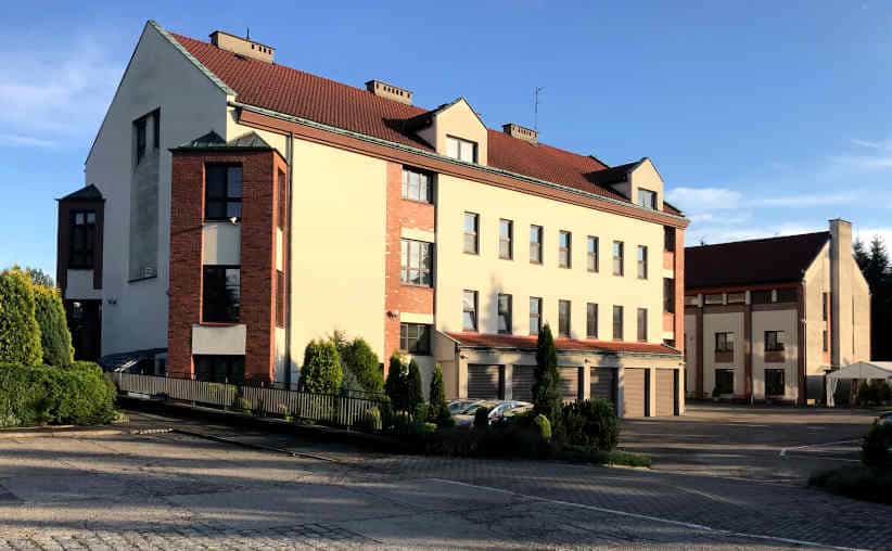 Centre for Dialogue and Prayer in Oświęcim building in the sunset light