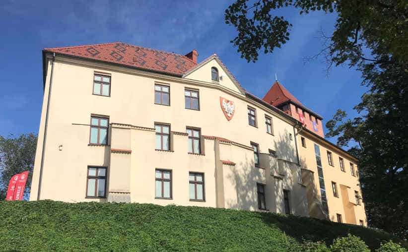 The castle hill in Oświęcim with a castle, photographed in the morning sun