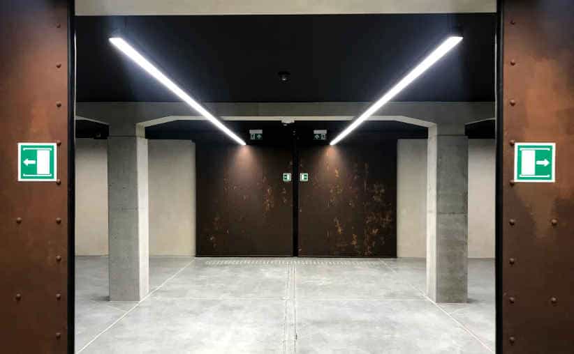 Doors to a tunnel to the main exhibition at Auschwitz I Main Camp reception underground.