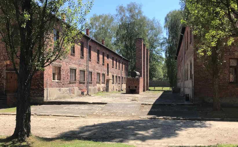 Chimneys and a water tank, remains of the bathhouse and kitchen between Blocks 1 and 2 at Auschwitz I Main Camp.
