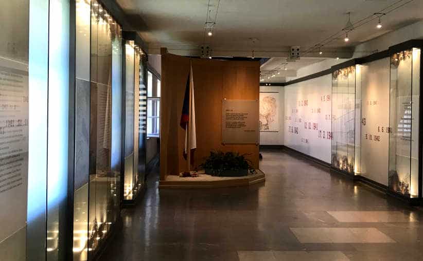 Corridor with dates and info texts on the walls in Block 16: Czech national exhibition, Auschwitz I Main Camp.