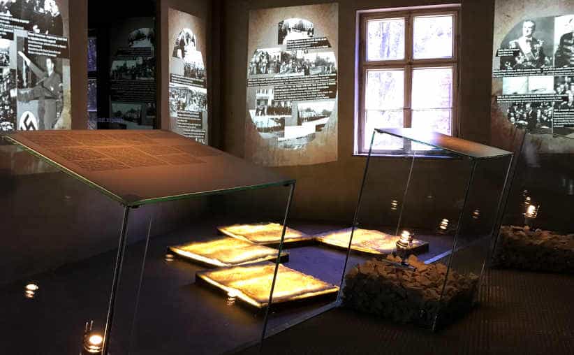 Glass info boards and photos with texts on Nazi history in Block 18: Hungarian national exhibition, Auschwitz I Main Camp.
