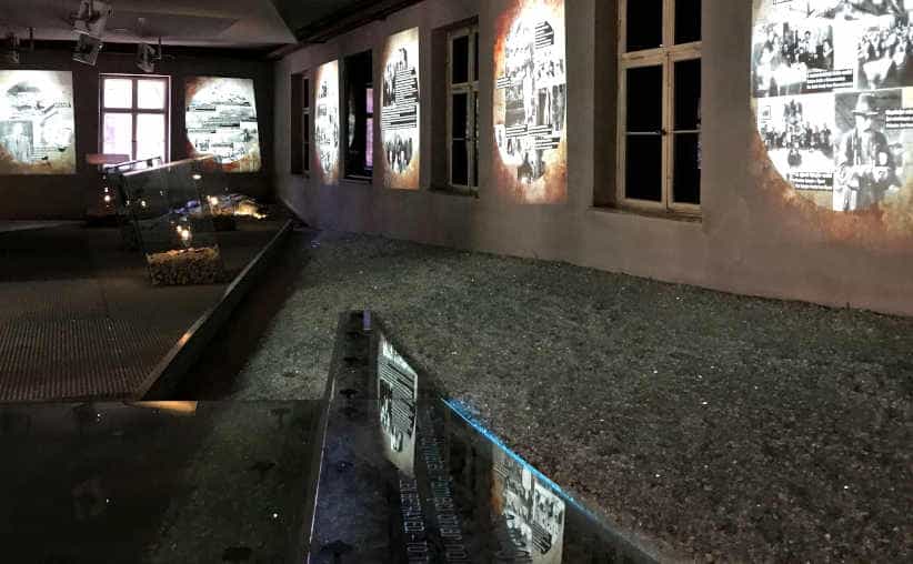 Broken glass floor, and projected info graphics on Nazi history in Block 18: Hungarian national exhibition, Auschwitz I Main Camp.