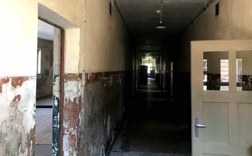 The corridor with doors in Block 3 at Auschwitz I Main Camp.