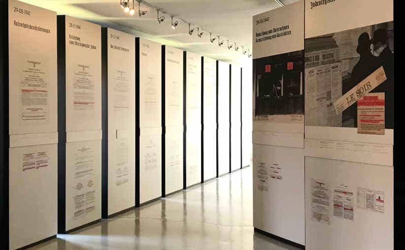 Walls with Nazi slogans on boards in Block 20: Belgian national exhibition, Auschwitz I Main Camp.