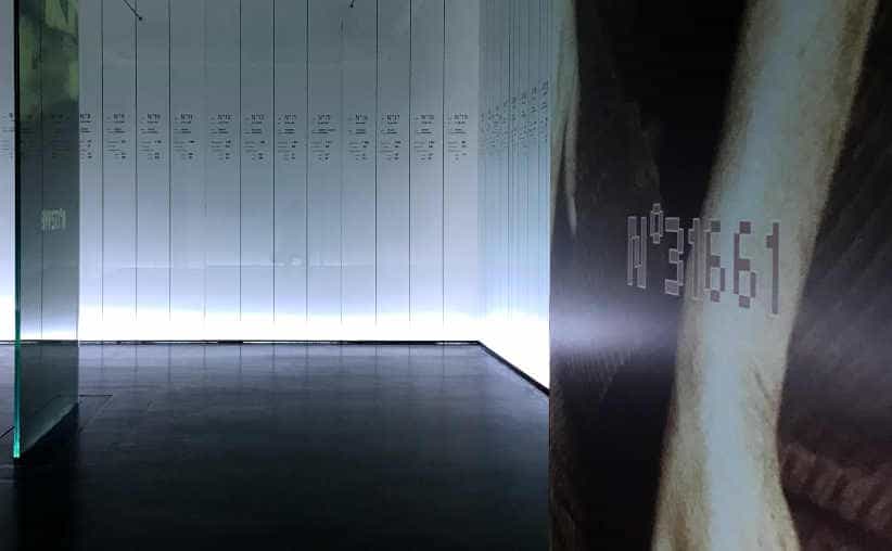 Glass walls with numbers and names of victims of Auschwitz in Block 20: French national exhibition.