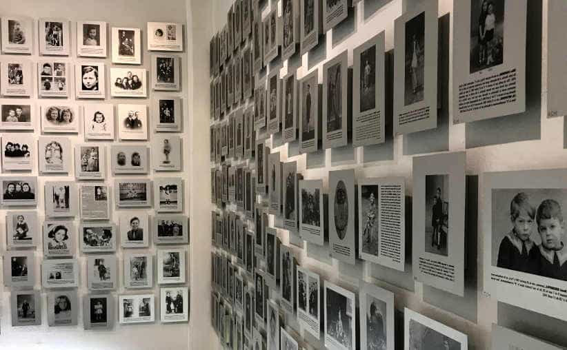 Walls with lots of photos of youngest Holocaust victims in Block 20: French national exhibition, Auschwitz I Main Camp.