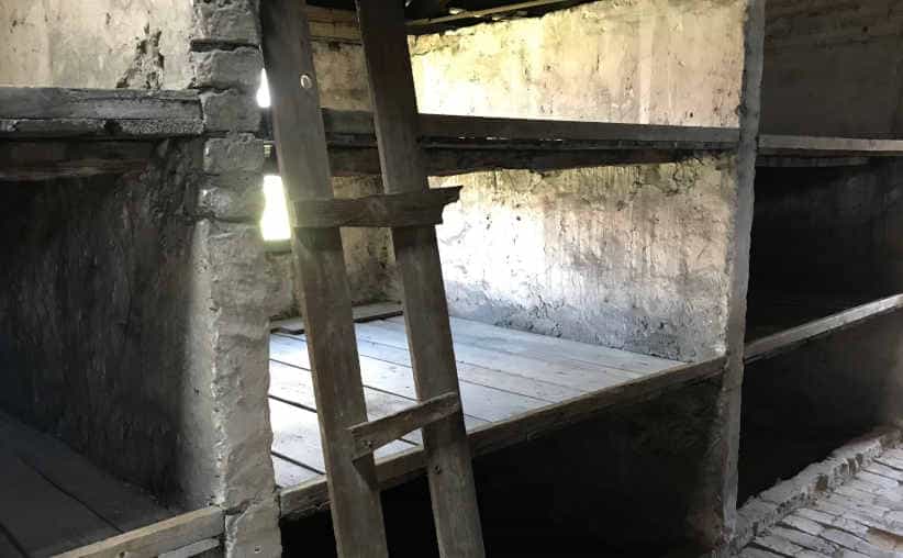 A ladder by prisoners' beds in a brick barrack at Auschwitz-II-Birkenau, sector BIa.