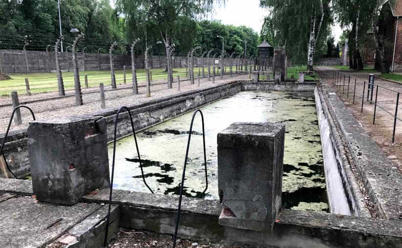 A water reservoir looking like a swimming pool behind Block 6 at Auschwitz I Main Camp.