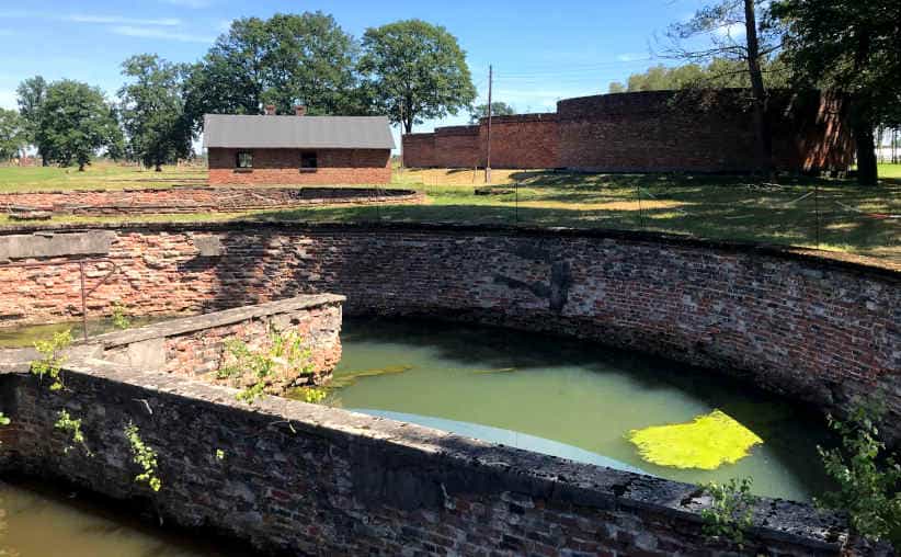 Sewage plant basin structures nearby the Sauna building at Auschwitz-II-Birkenau.