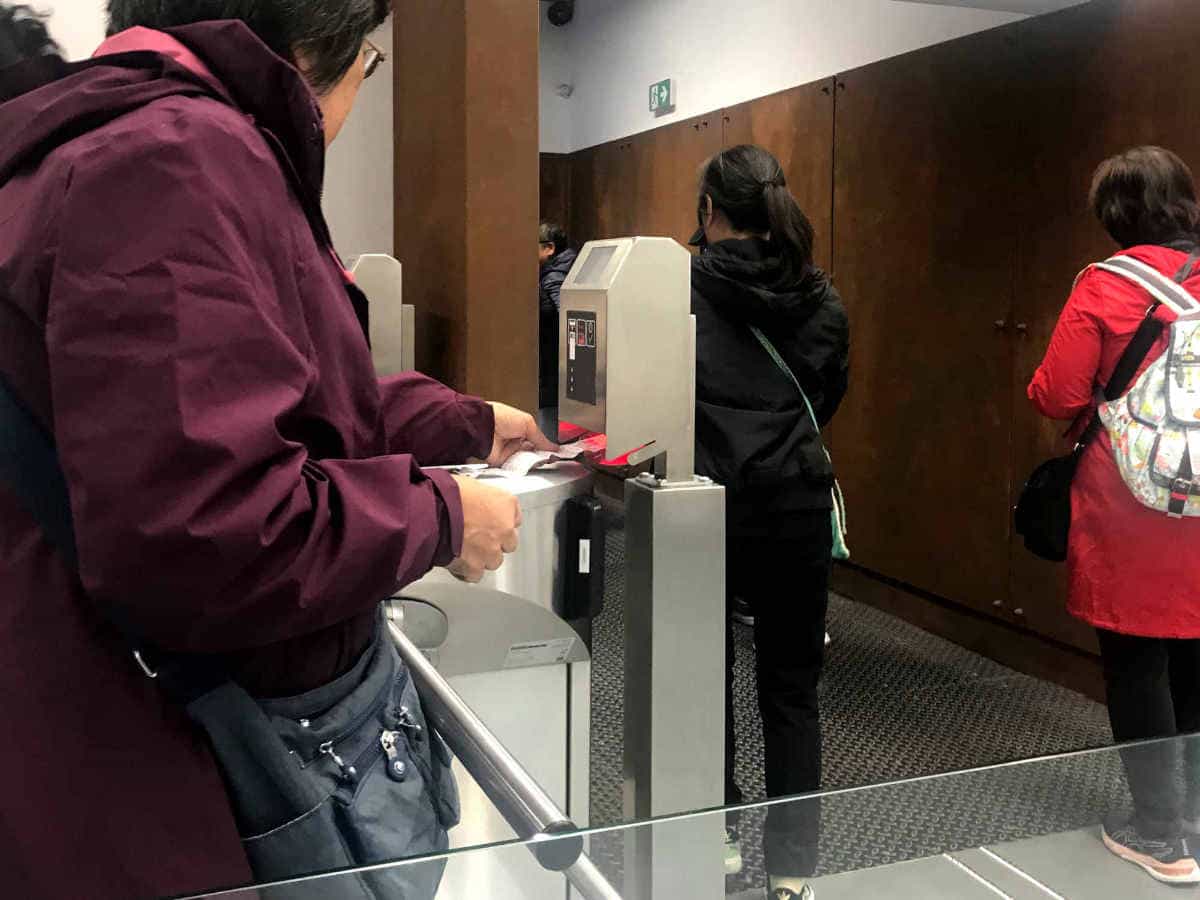 Scanning tickets before entering the former Auschwitz I Main Camp