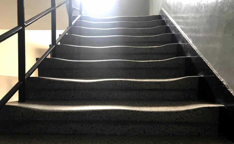 Auschwitz visit conditions: stairway with stairs wiped by visitors in an Auschwitz I Block.